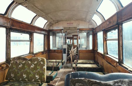 Photo for Blackpool, uk 01.01.2023 interior and retro seats of an Old forgotten rusty Blackpool tram. Famous iconic seaside tourist attraction transport carriages. Rusting historic iconic trams interior - Royalty Free Image