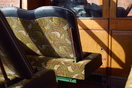 Photo for Dirty dusty retro 1960 pattern seats of an Old forgotten rusty Blackpool tram. Famous iconic seaside tourist attraction transport carriages. Rusting historic iconic trams interior - Royalty Free Image