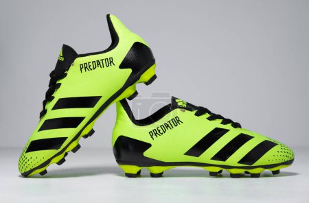 Photo for Kent, uk 01.01.2023 Adidas Predator 20.4 FxG Jr football boots green green kids junior rare Limited Edition Junior Trainers green and black training sports boots. iconic soccer shoes. - Royalty Free Image