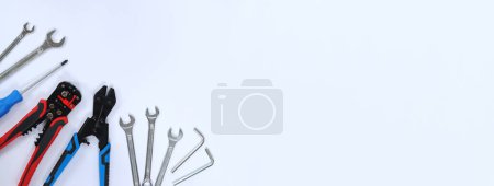 Photo for Repair tools on a white background, top view. Bolt cutter, wire stripper, screwdriver and wrenches. Place for text. Concept for Father's Day. Flat lay - Royalty Free Image