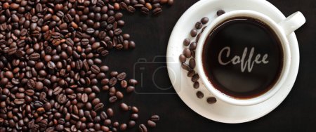 Photo for Coffee Americano. Top view of a cup of coffee on the background of roasted coffee beans. Lettering Coffee in a white cup. Banner - Royalty Free Image