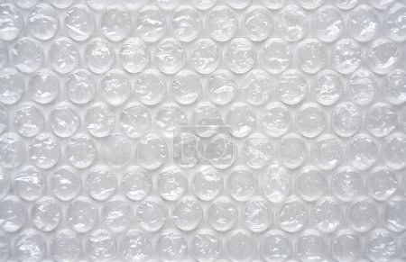 Foto de The texture of the packaging bubble film. Abstract background. Close-up. Selective focus. - Imagen libre de derechos