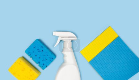 Photo for Cleaning products on a blue background. Top view. Copy space. - Royalty Free Image