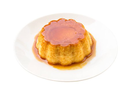 Photo for Pudding. Pudding is a dessert popular in both children and adults. It is sweet caramel Puddings, ready to eat, put on a white plate. (with clipping path) - Royalty Free Image