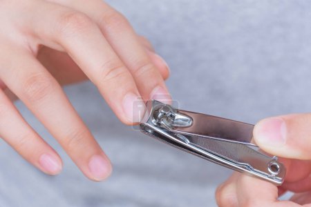 Photo for Long finger nails and dirty. It's time to cut with a nail clipper. - Royalty Free Image