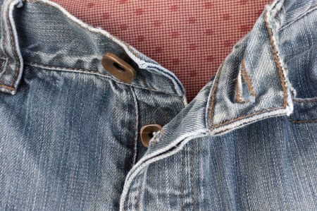 Photo for Jeans zipper instead of buttons to use. Takes longer to unbutton all. - Royalty Free Image