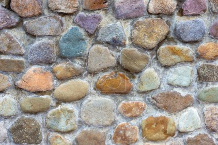 Foto de Pequeñas rocas colocadas con el fin de hermoso y sujetado por el cemento. Utilice un suelo y paredes, casa decorativa y jardín. - Imagen libre de derechos