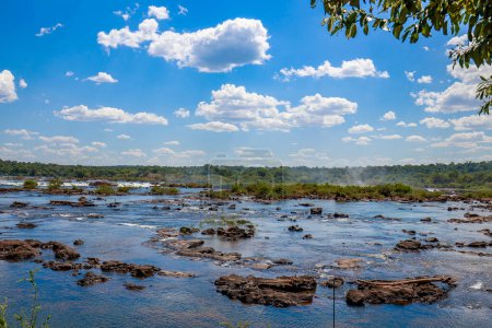 Panoramic view of the Iguazu Falls, border between Brazil and Argentina. The falls are one of the seven wonders of the world and are located in the Iguazu National Park, a UNESCO World Heritage Site.