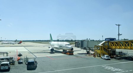 Photo for LINATE AIRPORT, ITALY - JUNE 12, 2022: Airport operations with commercial and private jet flights - Royalty Free Image