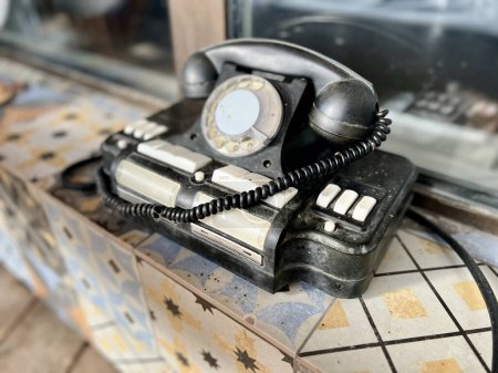 Vintage telephone near house. Selective focus. High quality photo