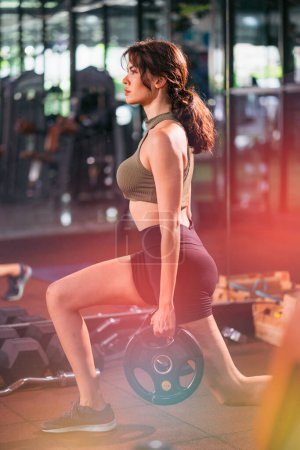 Photo for Portrait of a young athlete working out with a focused and assured attitude. Healthcare popular lifestyle exercise for women to get slim and strong. - Royalty Free Image