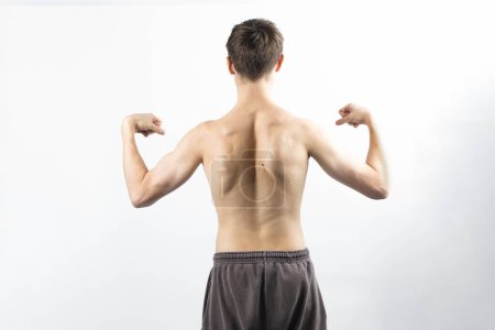 Photo for A 17 year old shirtless muscular teenage boy - Royalty Free Image