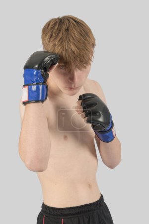 Photo for Shirtless male teenage MMA fighter with his guard up - Royalty Free Image