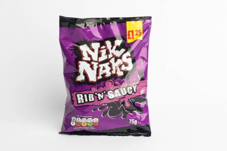 Photo for London, United Kingdom, 29th January 2024:- A packet of Nik Naks Rib 'n' Saucy British Potato Snacks on a white background - Royalty Free Image
