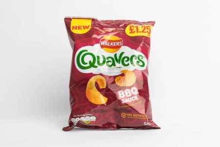 Photo for London, United Kingdom, 29th January 2024:- A packet of Walkers Quavers BBQ Sauce  British Potato Snacks on a white background - Royalty Free Image