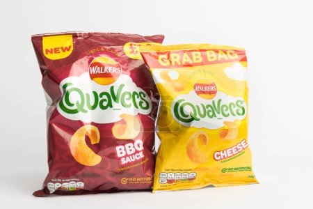 Photo for London, United Kingdom, 29th January 2024:- A pair of  packets of  Walkers Quavers British Potato Snacks on a white background - Royalty Free Image