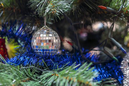 Photo for Silver mirror ball hanging on the Christmas tree - Royalty Free Image