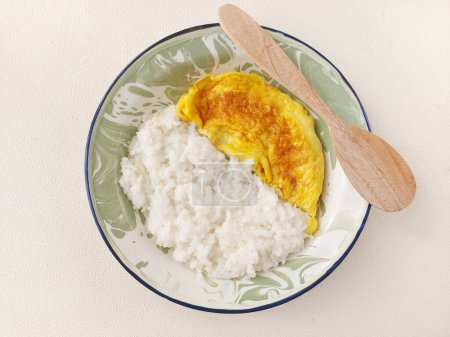Photo for Rice with omelette on enamel plate. Isolated background in white - Royalty Free Image