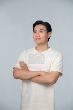 Foto de Asian young man posing on a white background - Imagen libre de derechos