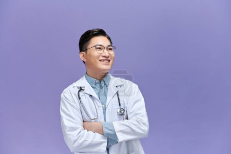 Photo for Portrait of young asian doctor isolated on purple background - Royalty Free Image