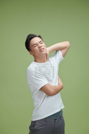 Photo for Young man suffering from pain in shoulder for having made an effort - Royalty Free Image