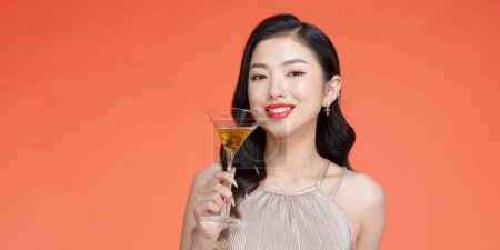 Photo for Glamour Woman In Sequin Evening Dress Standing With Glass Of Champagne - Royalty Free Image