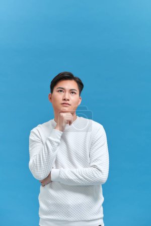 Photo for Full body young man with hand on chin thinking about question - Royalty Free Image