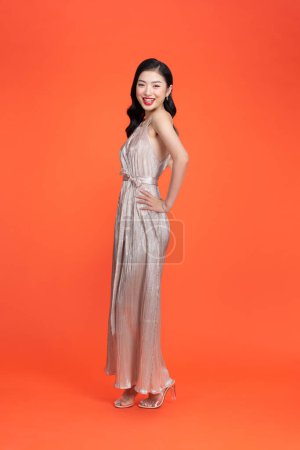 Foto de Nice lady ready for prom night wear cute dress isolated red background - Imagen libre de derechos
