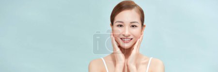 Photo for A smiling woman clean fresh face isolated on pastel background, banner - Royalty Free Image