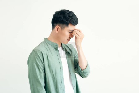 Photo for Young and handsome southeast asian man having a light headache - Royalty Free Image