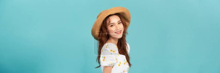 Photo for Beautiful smiling young woman in summer straw hat isolated on pastel blue background. - Royalty Free Image