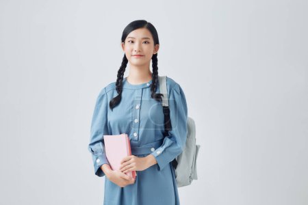 Photo for Young student woman l with backpack and notebook isolated on white background - Royalty Free Image