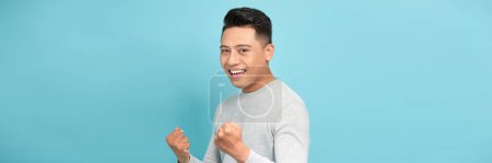 Photo for Very happy man and excited doing winner gesture with fists  raised - Royalty Free Image