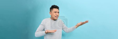 Photo for Annoyed and angry man raising hands and clench teeth outraged - Royalty Free Image