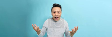Photo for Young handsome man surprised and amazed for success with arms raised and open eyes - Royalty Free Image