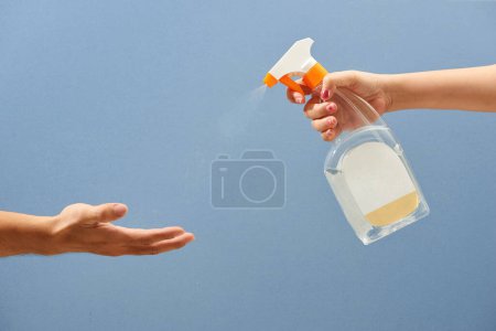 Photo for Spraying Antivirus Sanitizer Spray, Hand Sanitizer Dispenser, infection control concept. - Royalty Free Image