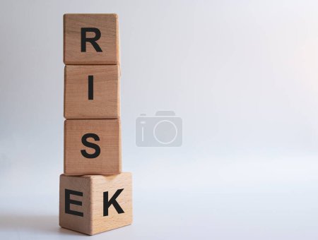 risk and rise inscription on wooden blocks.risk management idea concept.