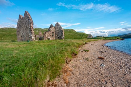 Photo for Next to a sandy beach,a ruined historical Georgian mansion, on the east shores of Loch Assynt,built 1726 for Kenneth MacKenzie of nearby Ardvrek Castle,first classical house in northwest highlands. - Royalty Free Image