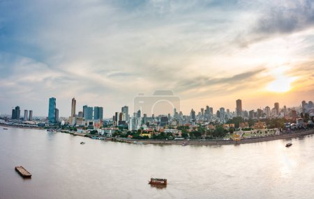 Photo for Rooftop view,looking across the river,before it merges with the Mekong.and small barges and other craft float on it's low waters, during the dry season. - Royalty Free Image