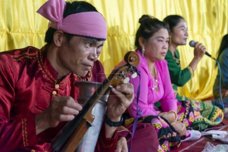 Photo for Pai,Thailand-April 04 2023: Local performers play instruments traditionally used for centuries in South east Asia,at a display of ancient culture of northern Thailand. - Royalty Free Image
