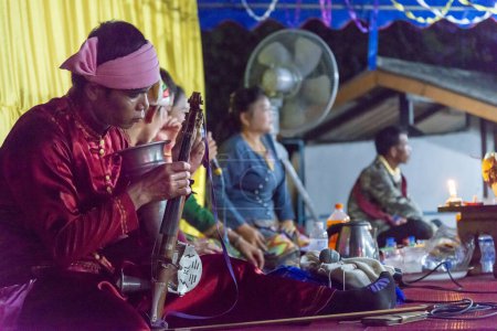 Photo for Pai,Thailand-April 04 2023: Local performers play instruments traditionally used for centuries in South east Asia,at a display of ancient culture of northern Thailand. - Royalty Free Image