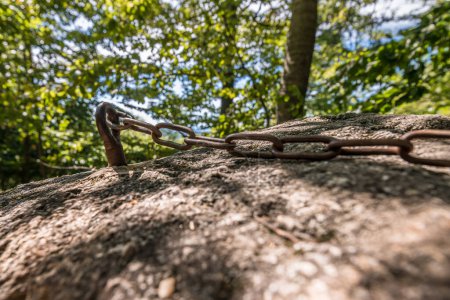 Photo for Close-up of iron chain at Wackelstein Regenstauf in the cult place from the prehistory of ancestors and ancestors in Upper Palatinate Bavaria and Germany - Royalty Free Image