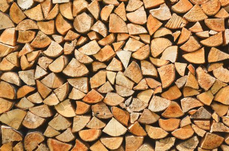 Foto de Firewood background. Preparation of firewood for the winter. Pile of firewood. - Imagen libre de derechos