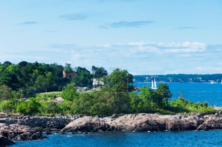 The rocky coast at Fort Sewall in marblehead massachusetts on a sunny day.