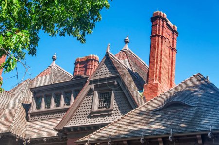 The roof of the historic Mark Twain house in Hartford, Connecticut on a sunny day.