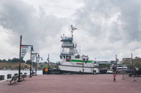Photo for Baltimore, Maryland. September 30, 2019. The historic Cape May tugboat docked within the inner harbor located in Baltimore Maryland on an overcast day. - Royalty Free Image