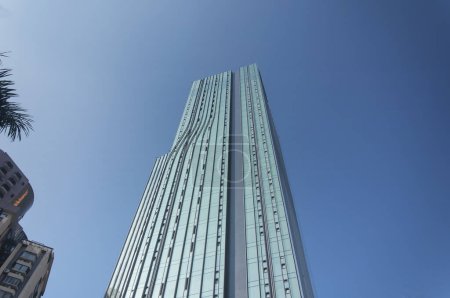 a modern building within the city of Shenzhen China Luohu district on a sunny day.