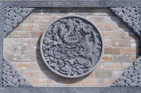 A phoenix mural on the side of a building at Chi Wan Tian Hou Temple in Shenzhen China.