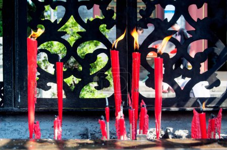 Buddhist prayer candles burning in Chi Wan Tian Hou Temple in Shenzhen China.