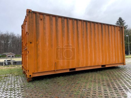 Photo for Yard waste dumpster. Construction dumpster for bulky household waste or loaded dumpster - Royalty Free Image